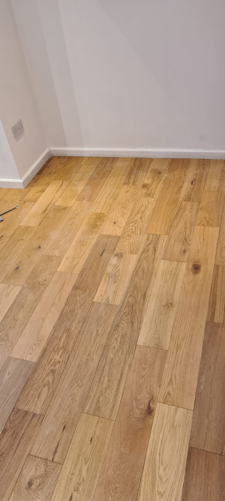 Small kitchen with cork flooring and teal tiles