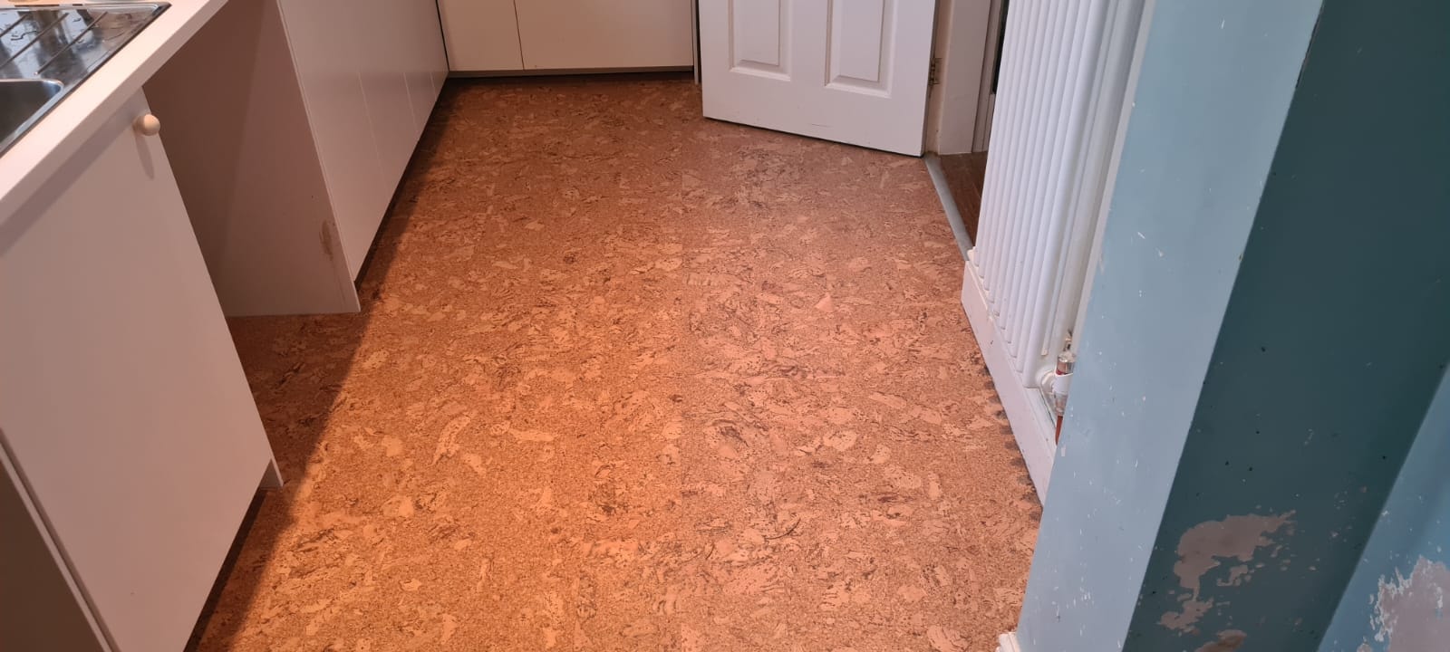 Cork flooring in modern kitchen and hallway